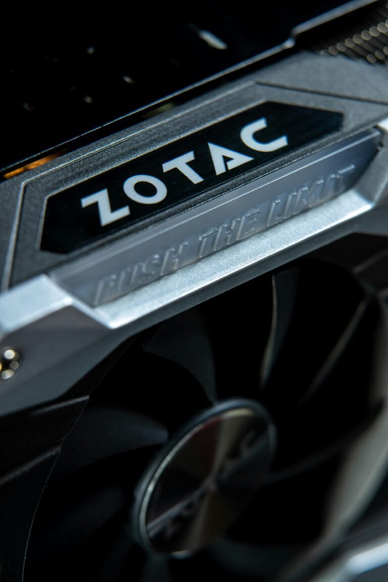 Close-up of a Zotac graphics card showcasing the logo and the phrase "Push the Limit," highlighting its powerful cooling fan design and advanced technology for gaming and graphics performance.