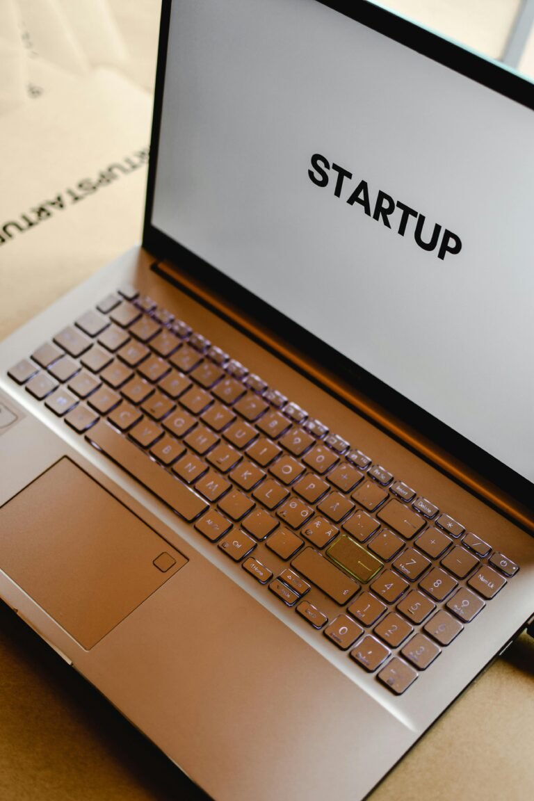 Close-up of a laptop keyboard with the word "STARTUP" displayed on the screen, symbolizing entrepreneurship and innovation in the digital age.